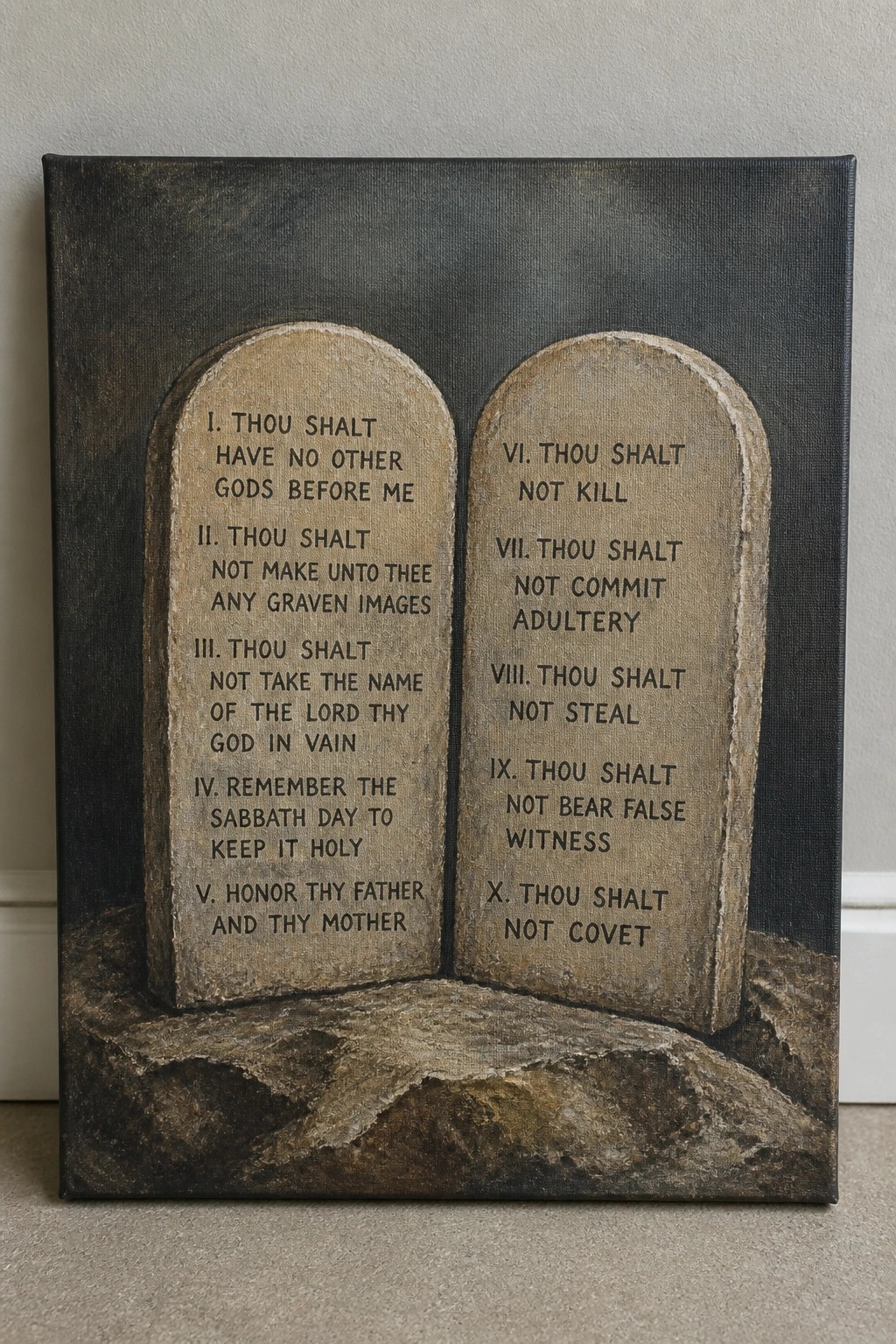 Two stone tablets inscribed with the Ten Commandments on a dark canvas painting.