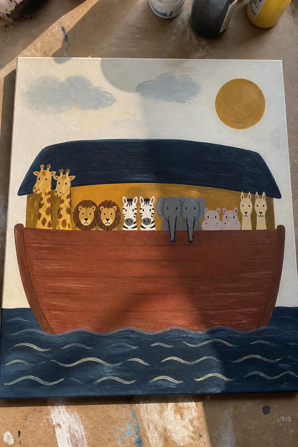 Vibrant painting of Noah's ark with animal pairs on wavy blue water under sun