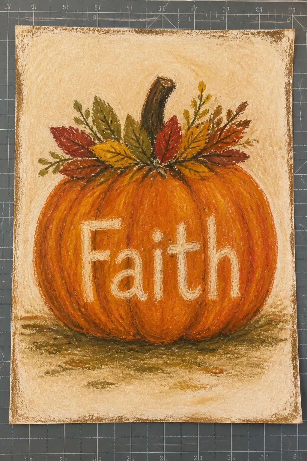 Textured painting of orange pumpkin with Faith and autumn leaves on beige background.
