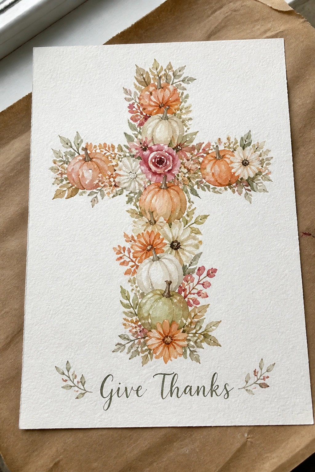 Watercolor cross of pumpkins, flowers, and leaves above 