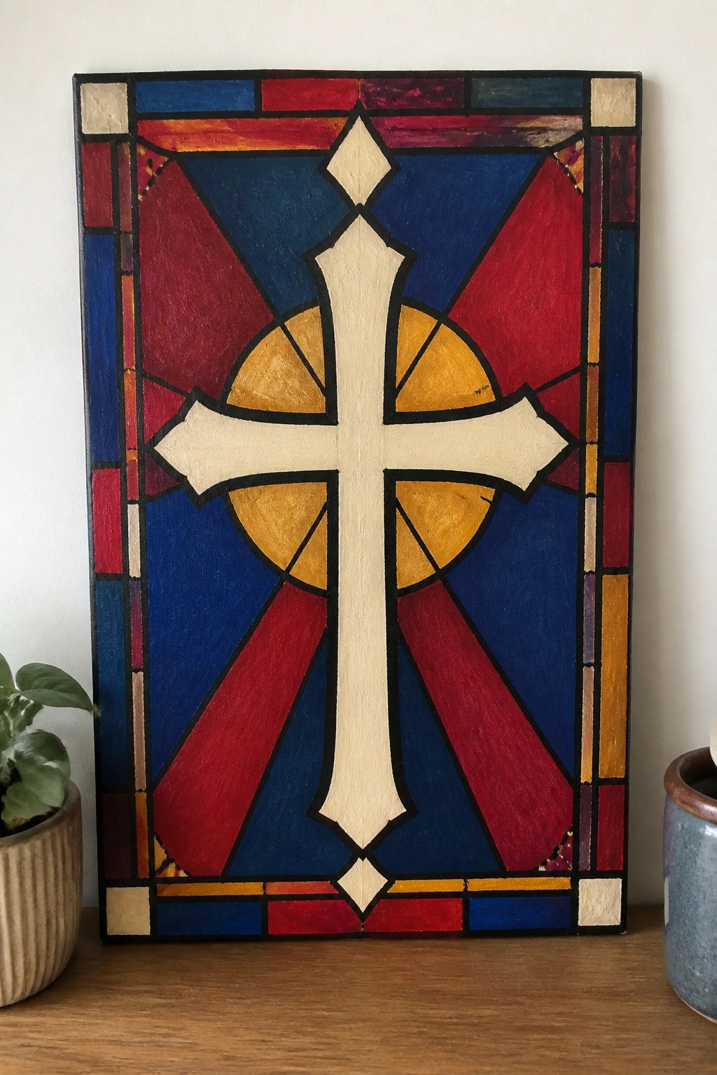Stained glass style panel with central white cross in red blue and yellow patterns