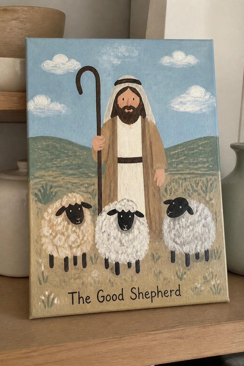 Bearded shepherd in robes holding crook with three sheep in meadow under blue sky