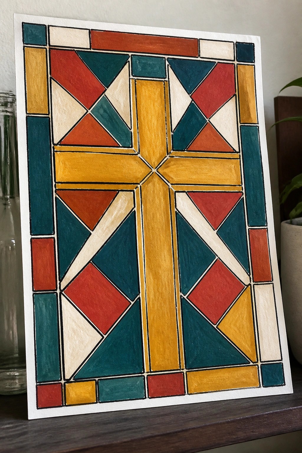 Colorful geometric stained-glass artwork with central yellow cross in red and teal.