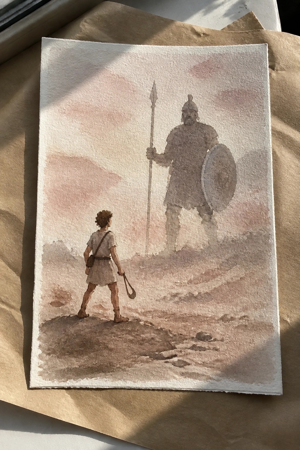 Watercolor of boy with sling facing towering armored warrior with spear and shield.