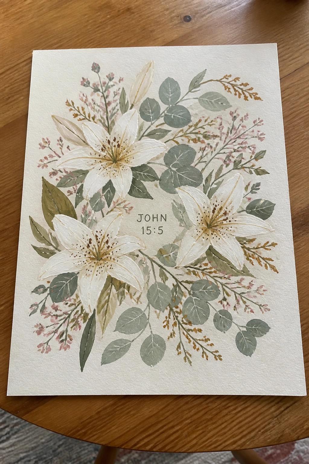 Watercolor painting of white lilies with green foliage and John 15:5 text
