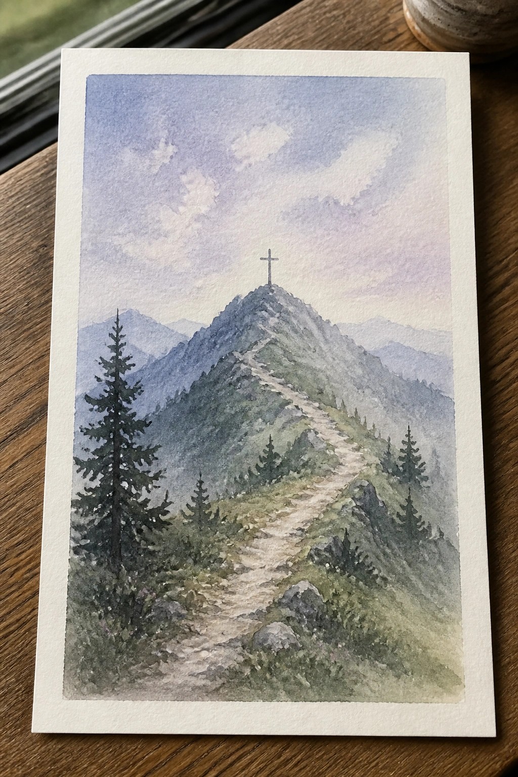 Watercolor of winding mountain trail leading to cross-topped peak amid pine trees.