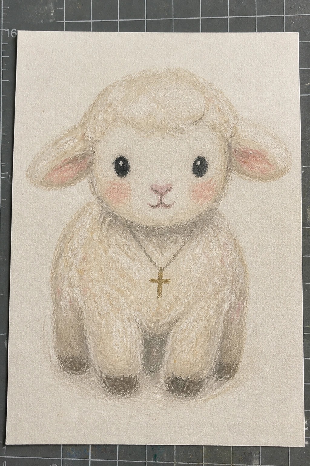 Cute fluffy lamb with gold cross necklace, big black eyes, and pink cheeks sitting