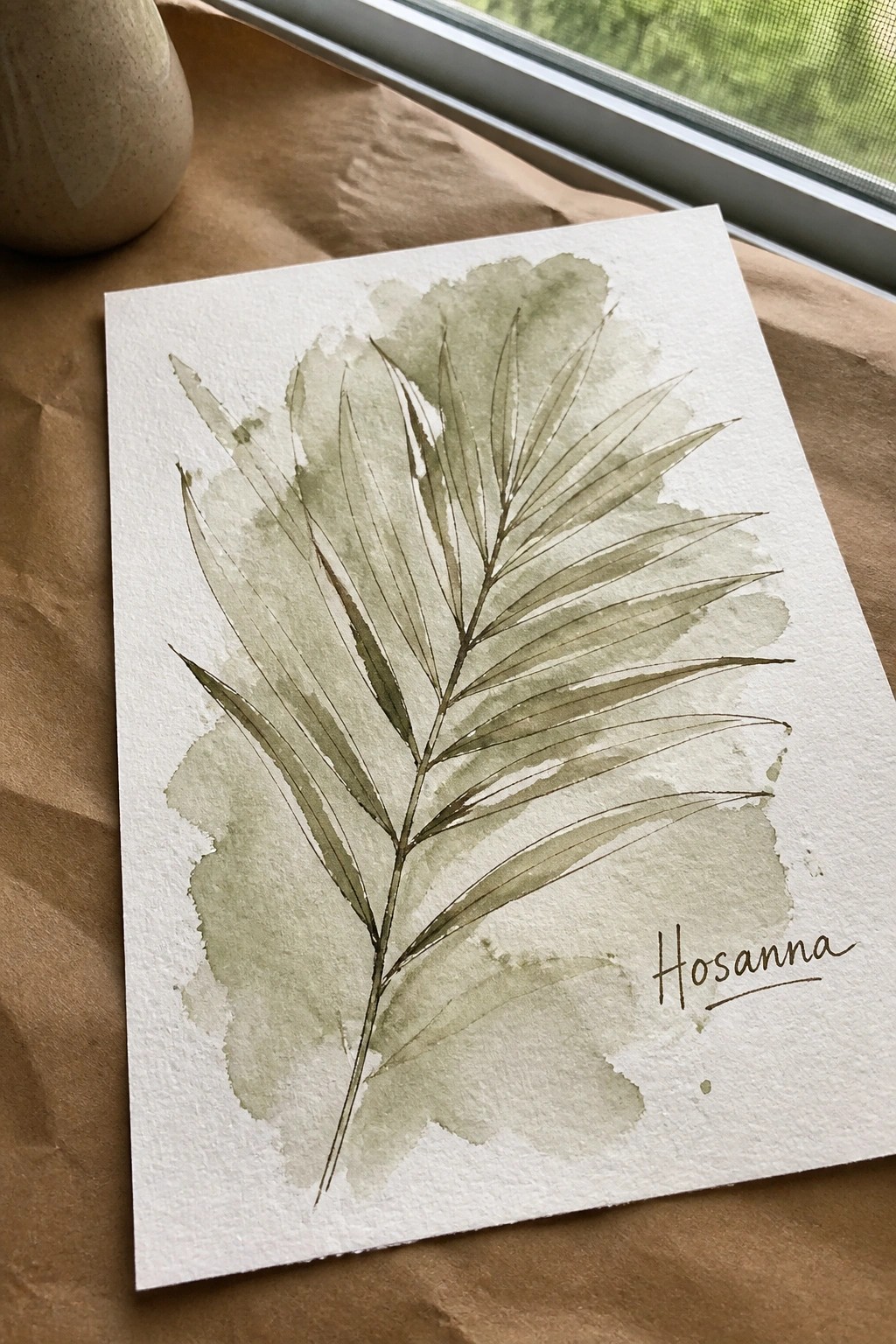 Green watercolor palm frond artwork with 