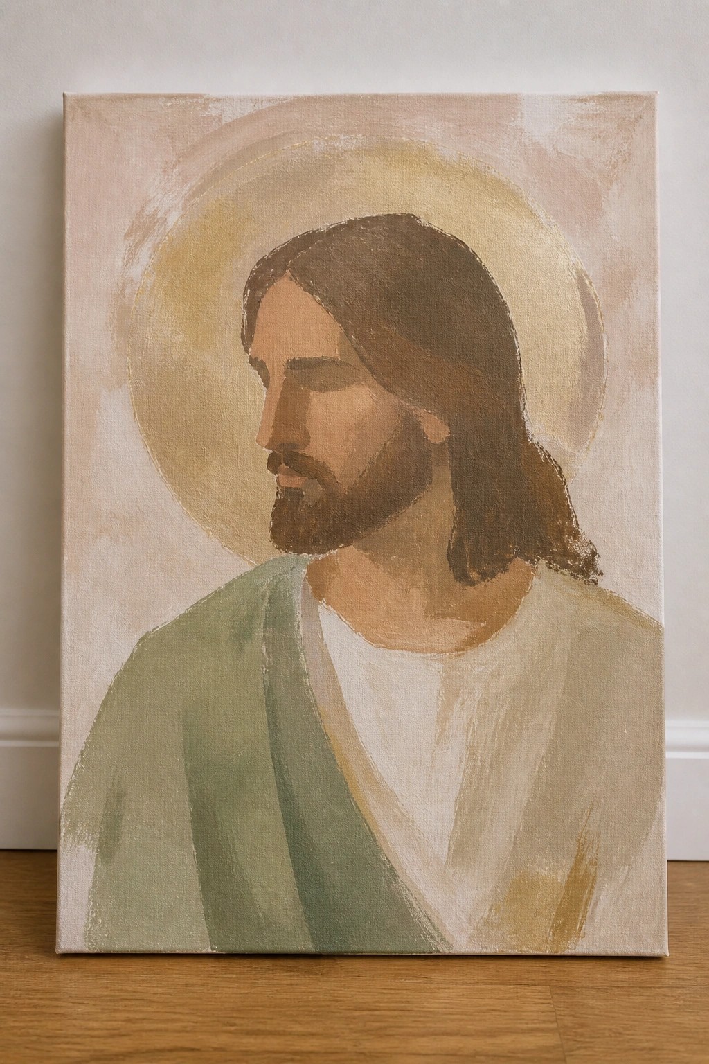 Abstract painting of Jesus in profile with beard, halo, and green robe on canvas
