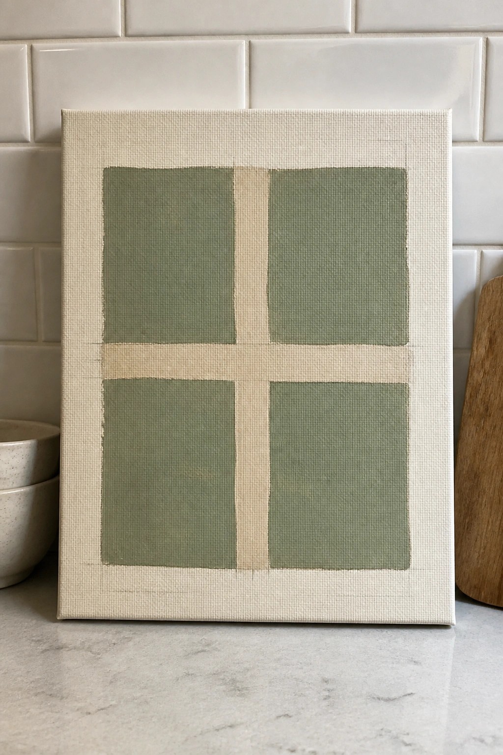 A canvas shows four sage green rectangles in a 2x2 grid separated by a beige cross on an off-white background.