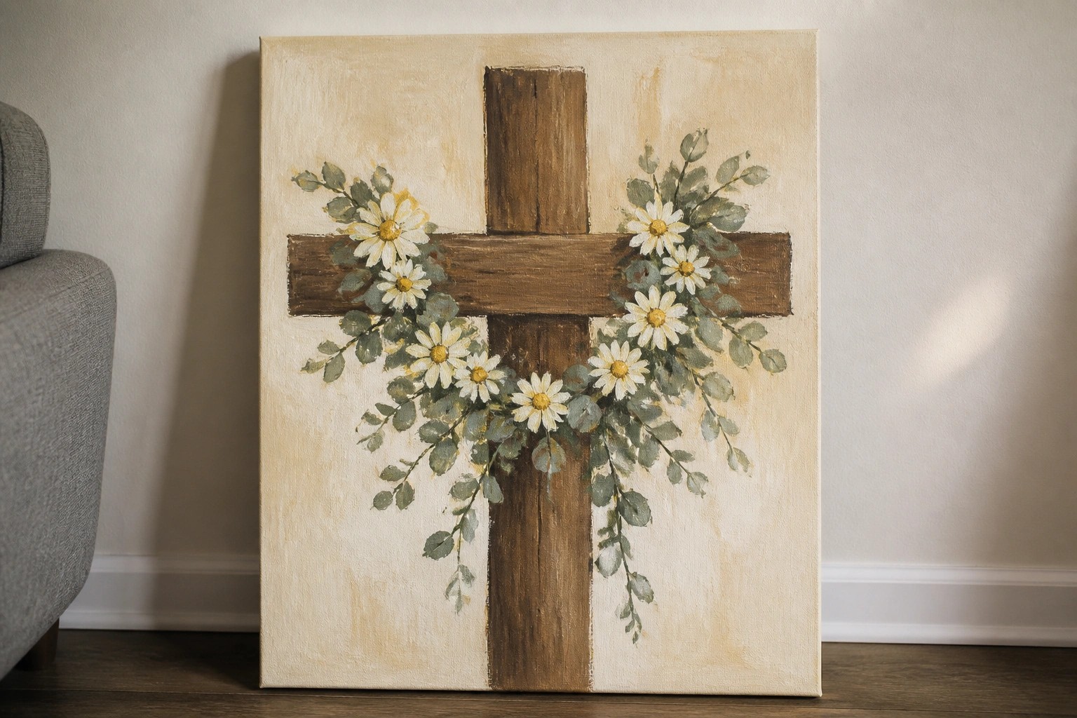 Rustic wooden cross with white daisies and green eucalyptus on textured beige canvas
