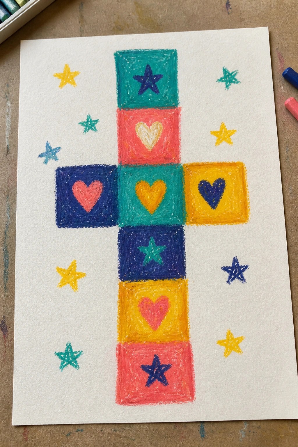 Colorful crayon cross of squares with hearts and stars, surrounded by scattered doodled stars.