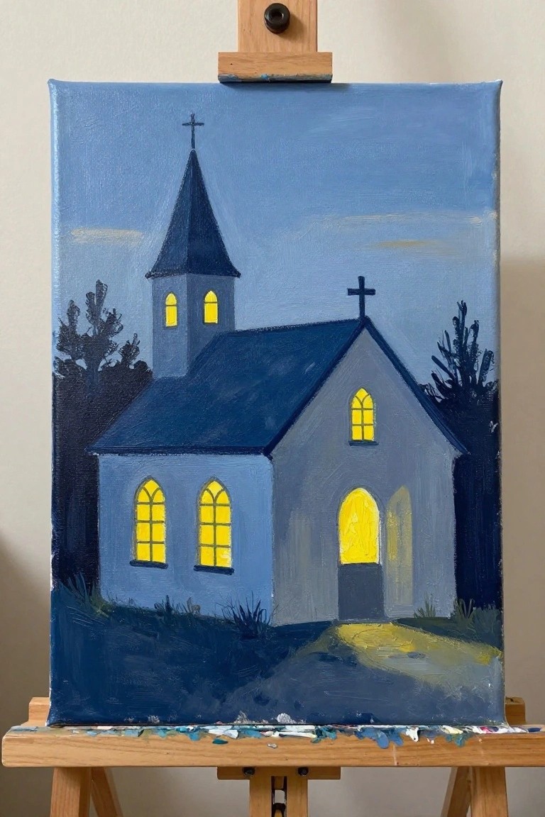 Painting on easel of gray church with glowing yellow windows under blue sky