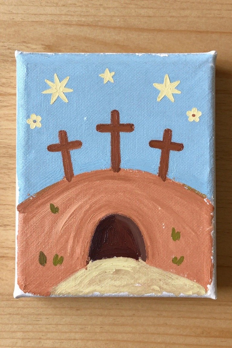 Three crosses atop a brown hill above a dark arched tomb under a starry blue sky