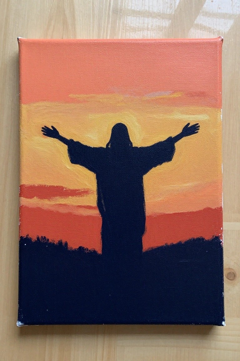 Silhouetted robed figure with arms outstretched against vibrant orange-yellow sunset on canvas.
