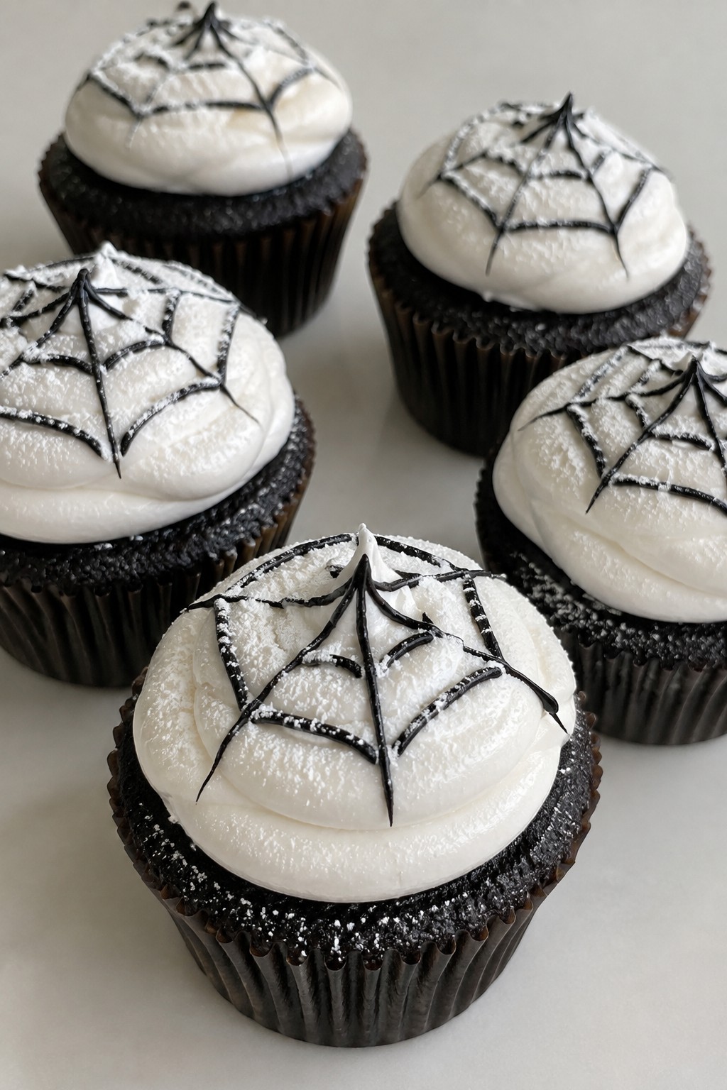 Black Cocoa Cupcakes with Marshmallow Spiderweb Frosting