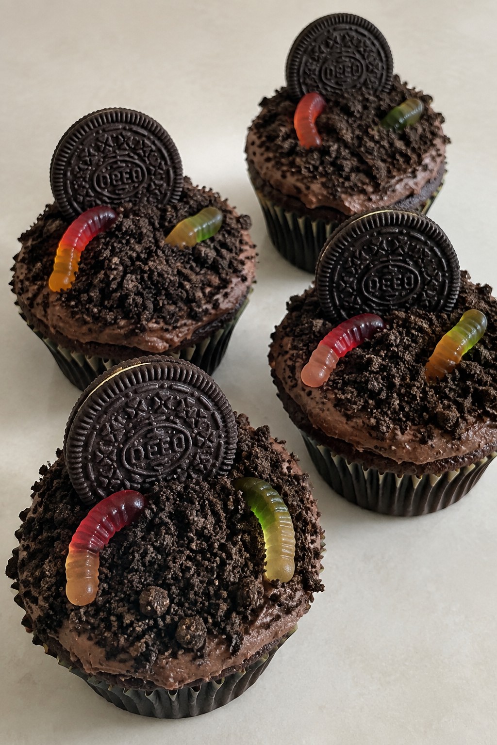 Oreo Dirt Cupcakes with Gummy Worms and Cookie Tombstones