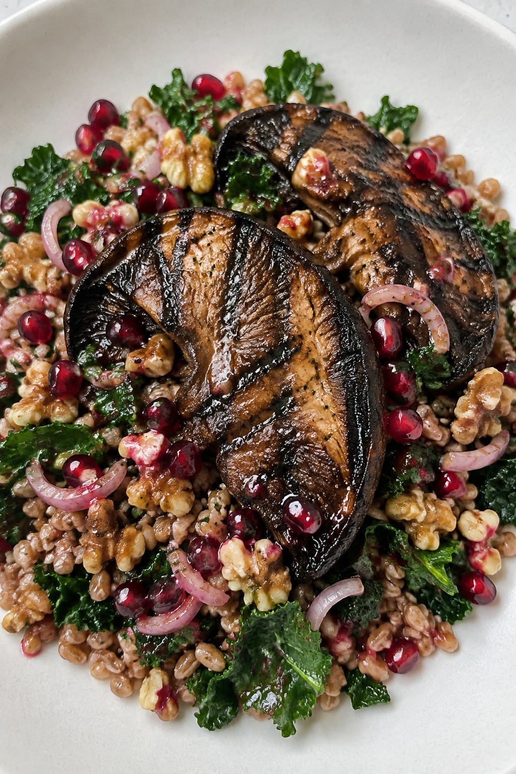 Grilled Portobello Steaks with Warm Farro Salad and Pomegranate Vinaigrette