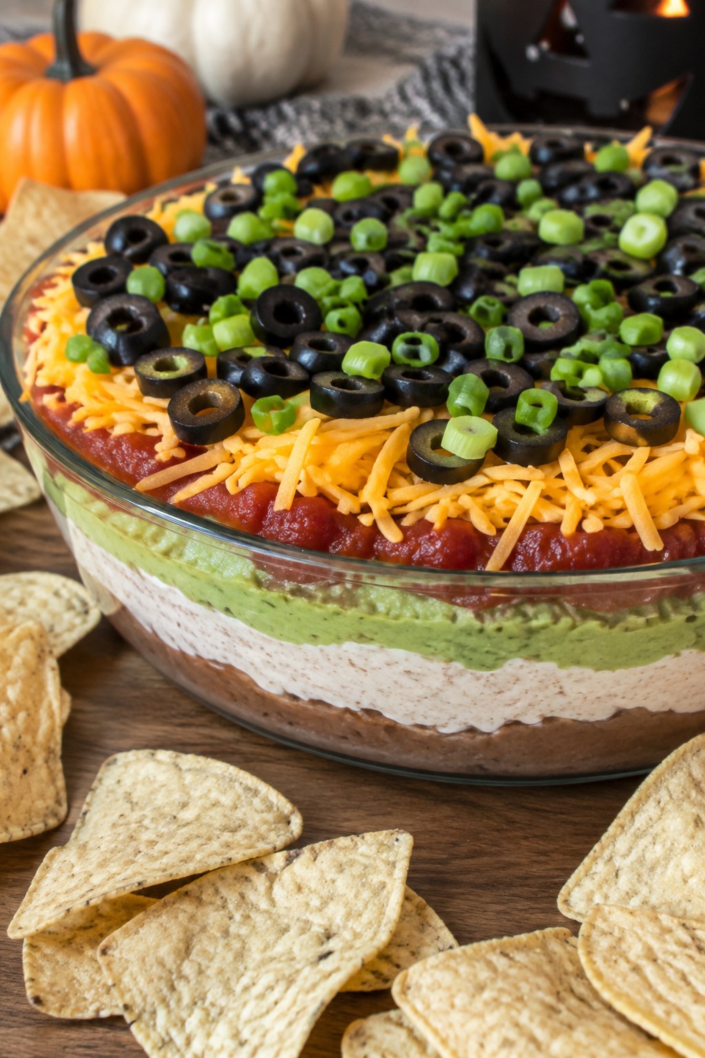 Spooky Seven-Layer Taco Dip Platter with Tortilla Chips