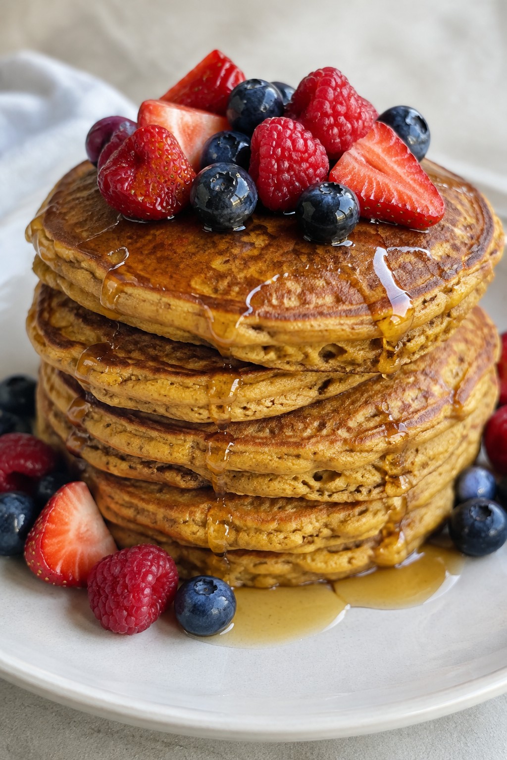 Pumpkin Spice Pancake Stack with Maple Syrup and Berries