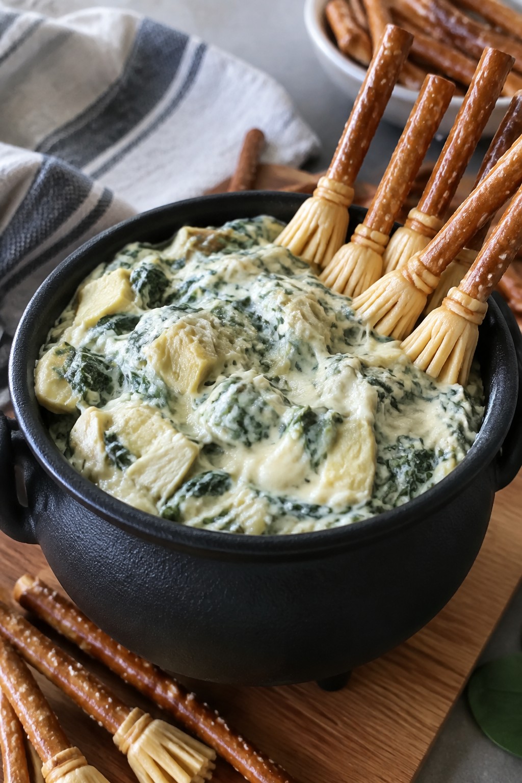 Cauldron Spinach Artichoke Dip with Pretzel Broomsticks