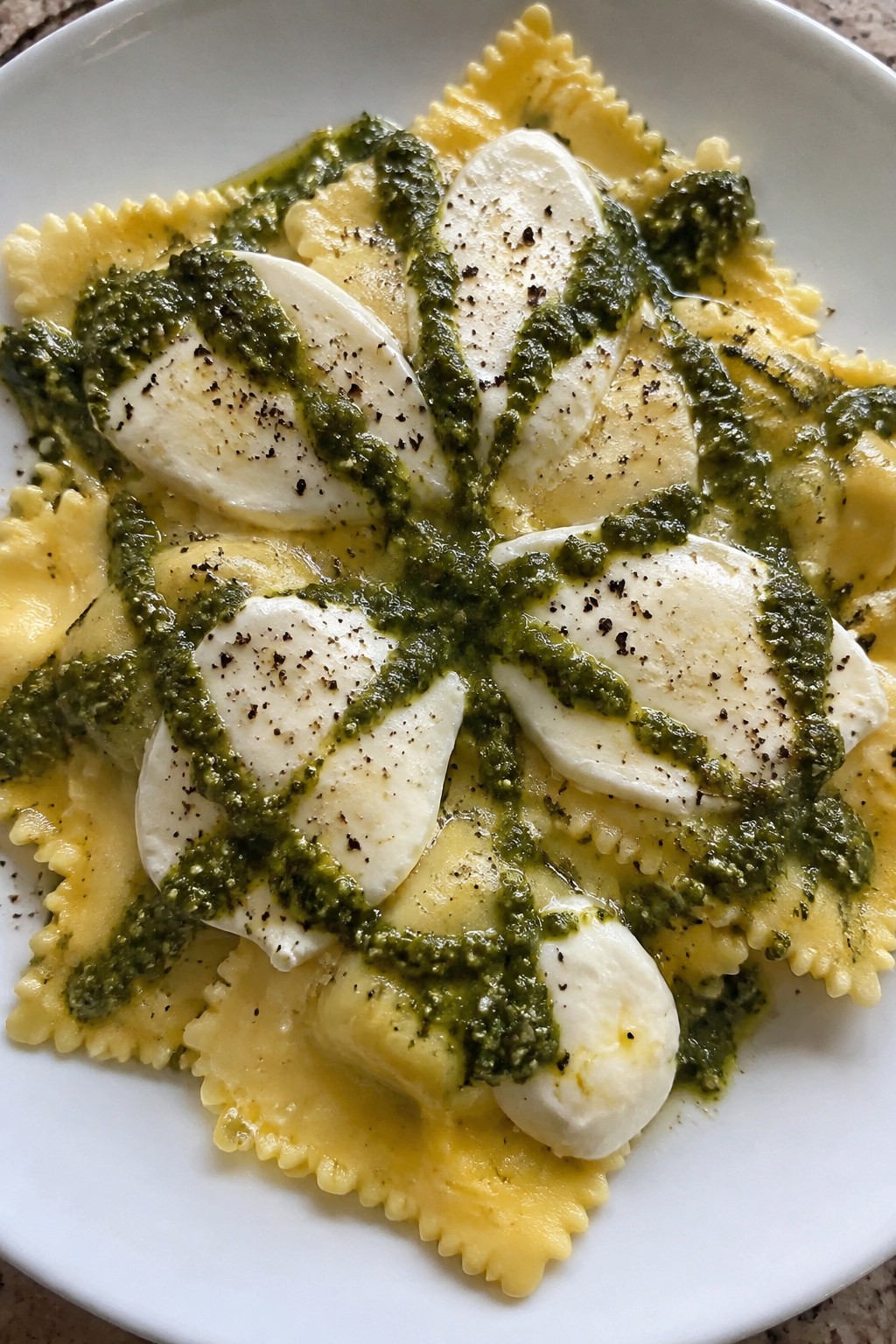 Spiderweb Pesto Ravioli with Mozzarella