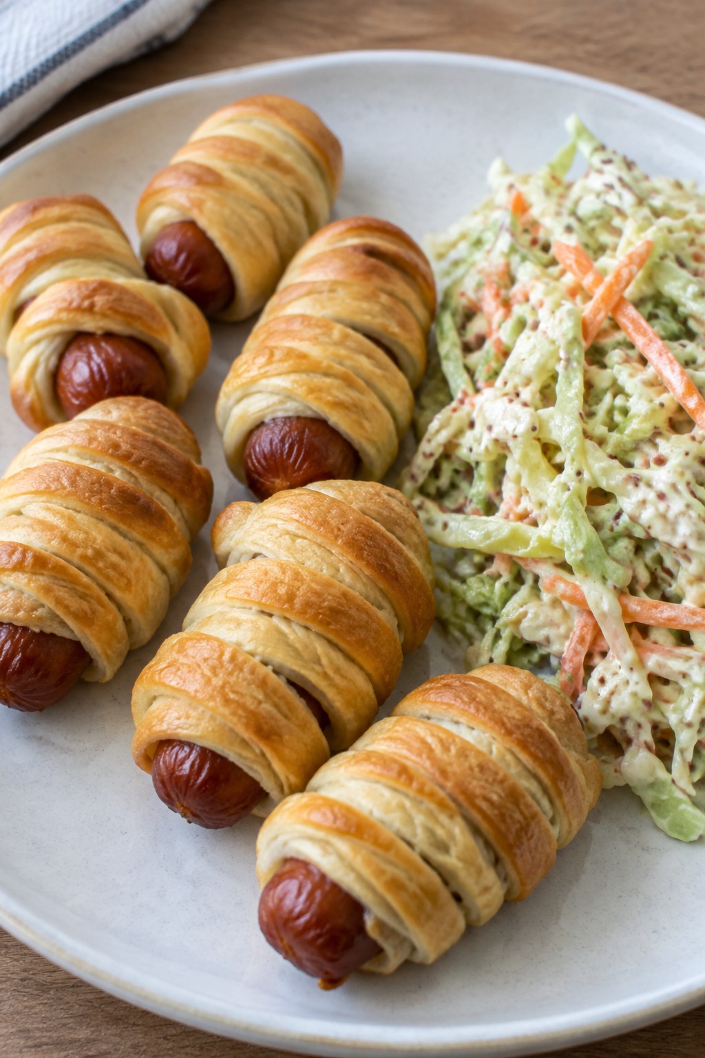 Mummy Wrapped Sausage Sliders with Dijon Slaw