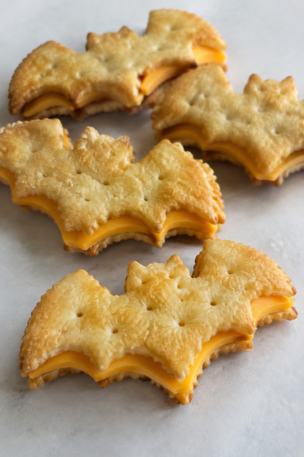 Bat-Shaped Cheese and Cracker Sandwiches Using Cookie Cutters