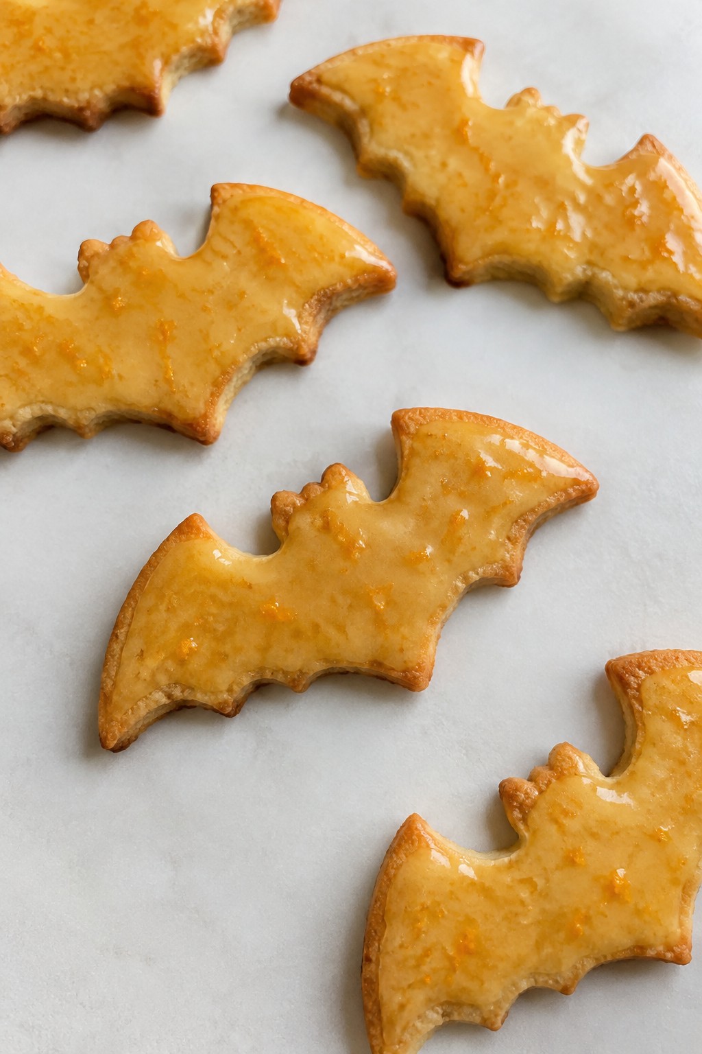 Bat-Shaped Shortbread Cookies with Orange Glaze
