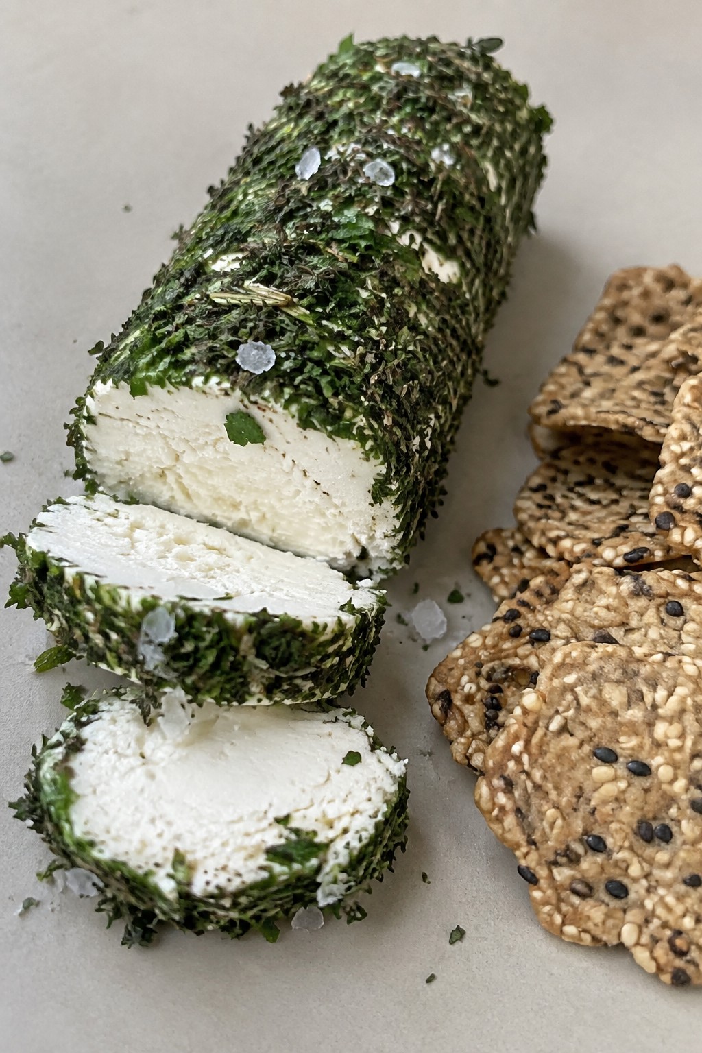 Herb-Crusted Goat Cheese Log Served with Seeded Crackers
