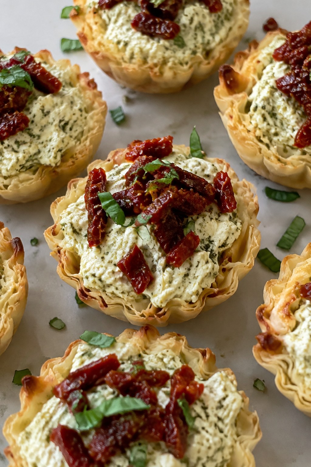 Ghostly Pesto Cheese Tartlets with Sun-Dried Tomatoes