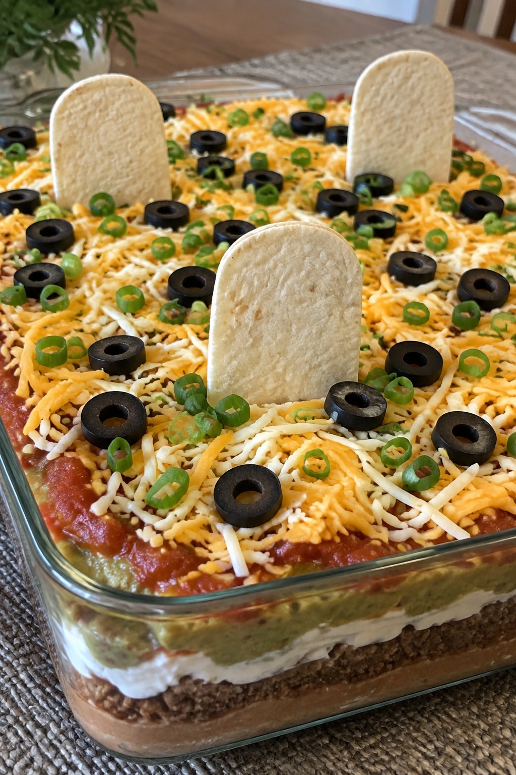 Graveyard Seven-Layer Taco Dip with Tortilla Tombstones