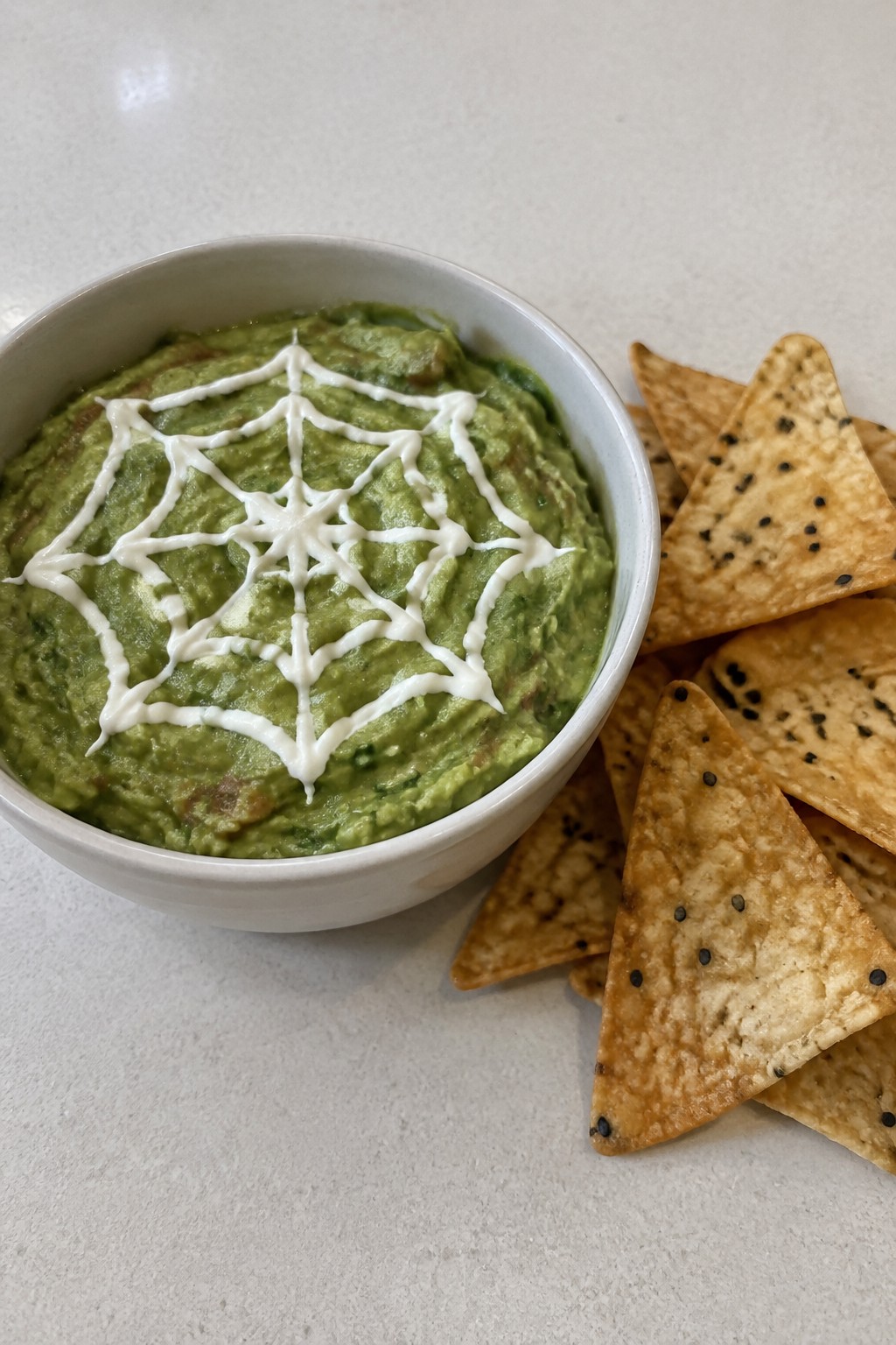 Spiderweb Guacamole with Black Sesame Tortilla Chips