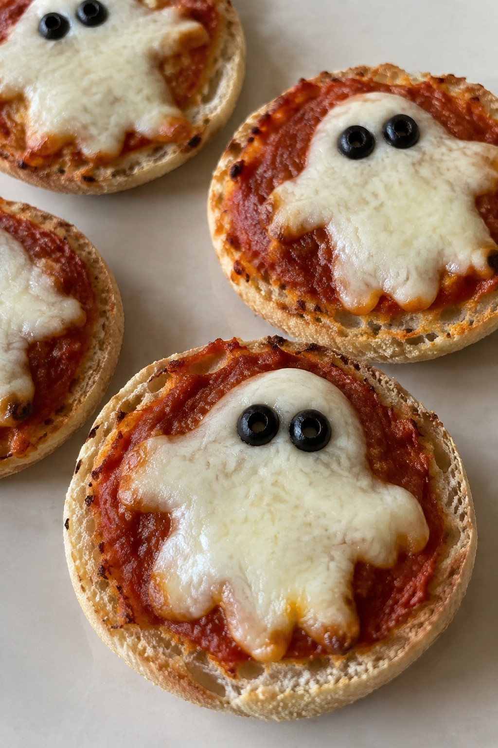 Mini Ghost Pizzas on English Muffins