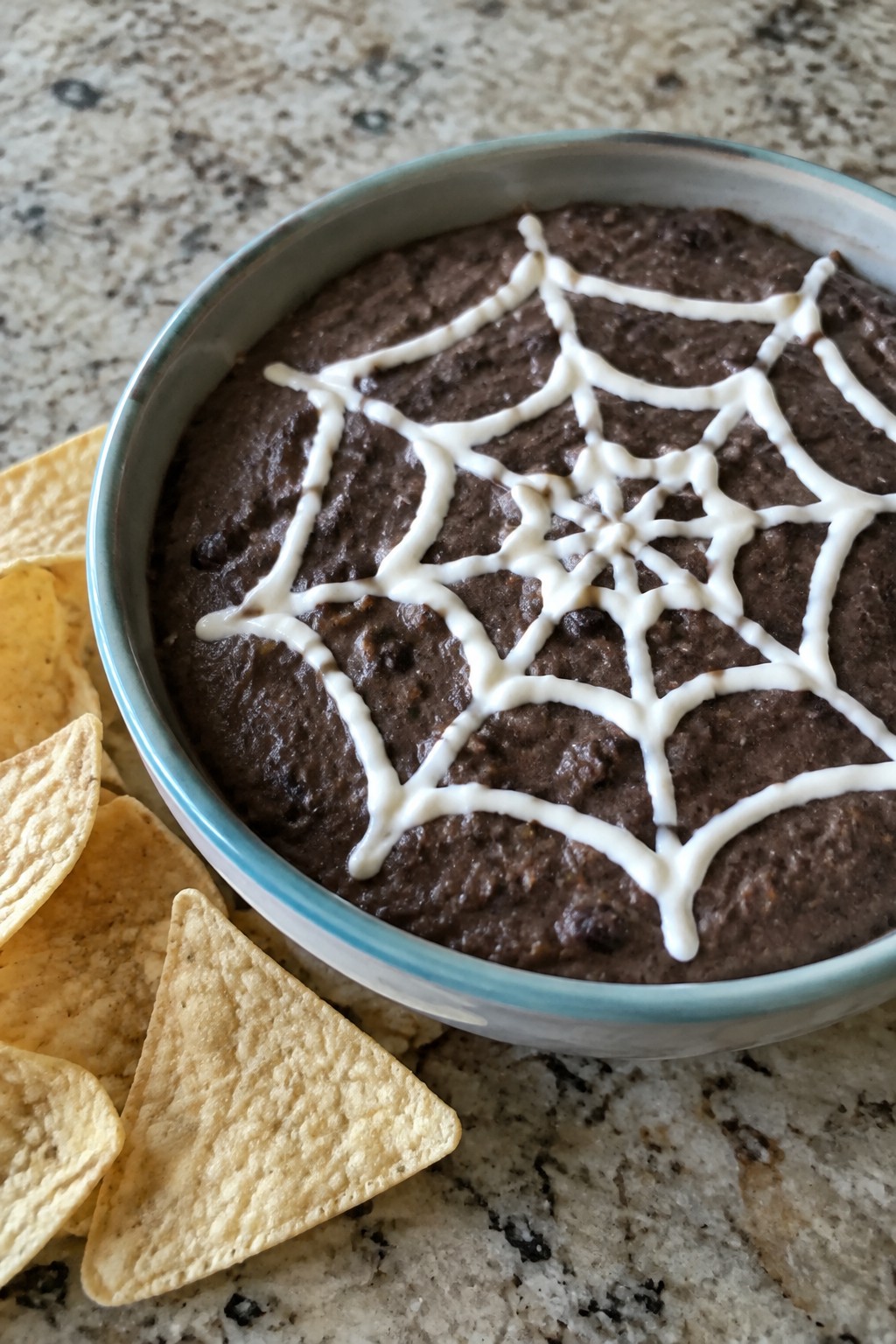 Spiderweb Black Bean Dip with Tortilla Chips