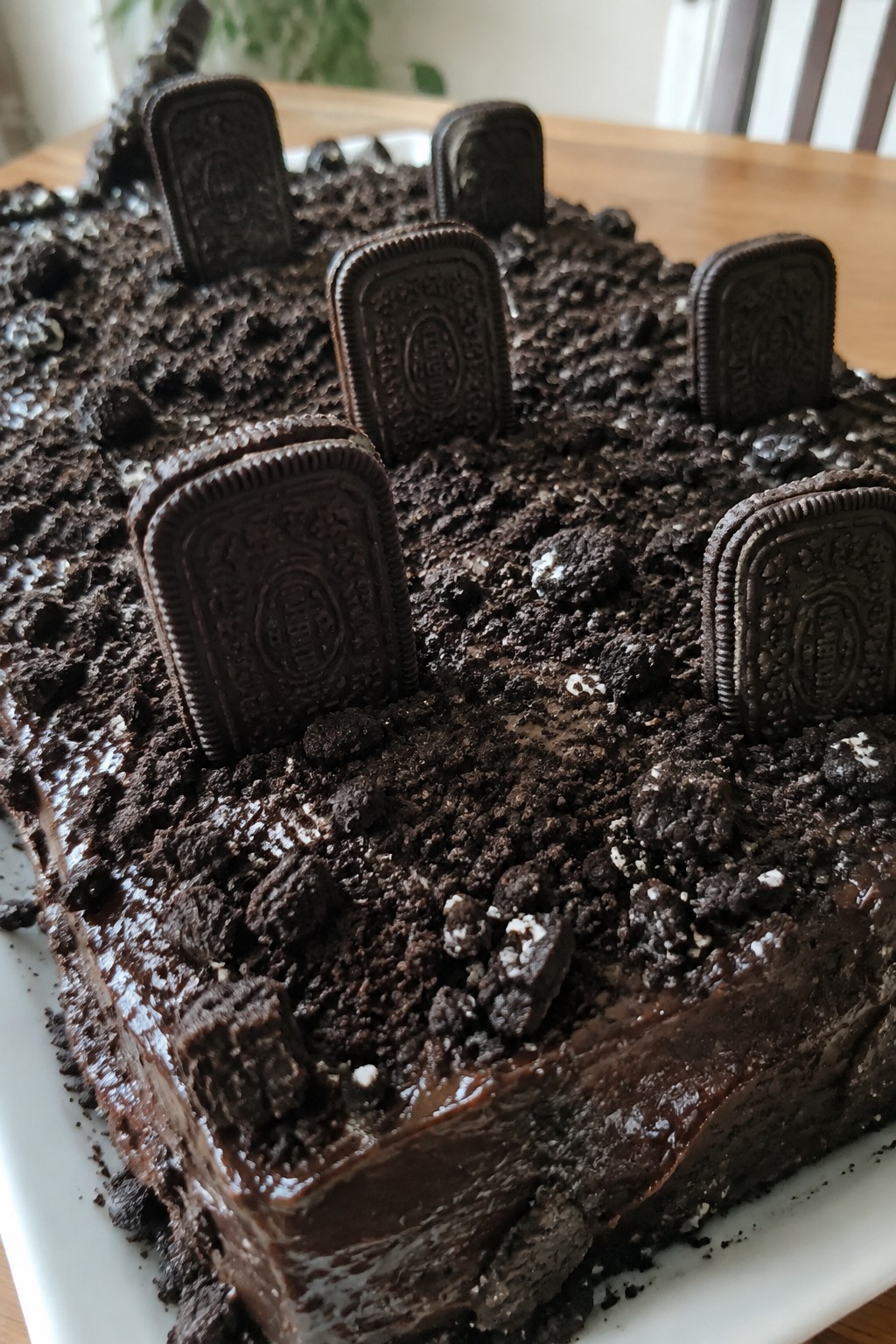Graveyard Dirt Chocolate Cake with Oreo Crumbs and Cookie Tombstones