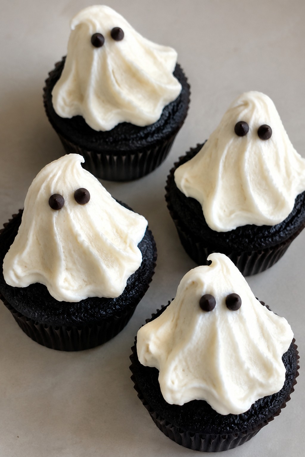 Black Cocoa Cupcakes with Vanilla Ghost Frosting