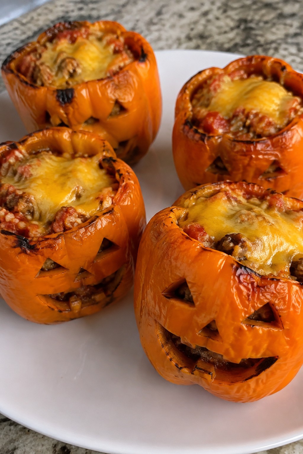 Jack-o'-Lantern Stuffed Bell Peppers with Rice and Turkey