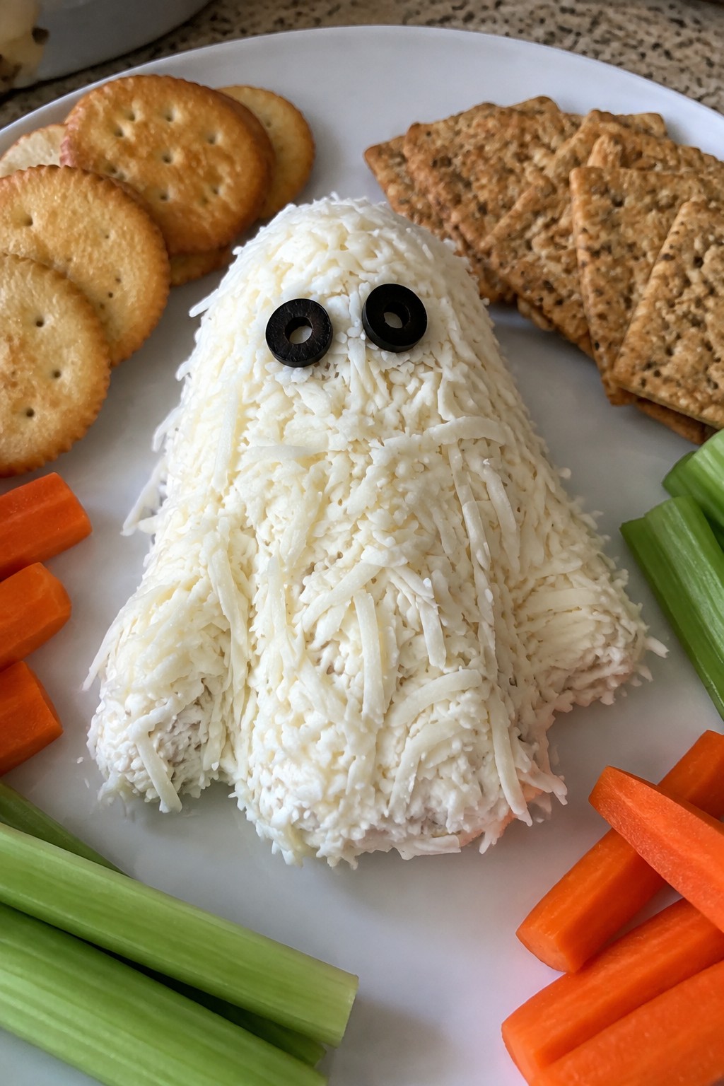 Ghostly Cheese Ball with Crackers and Veggies
