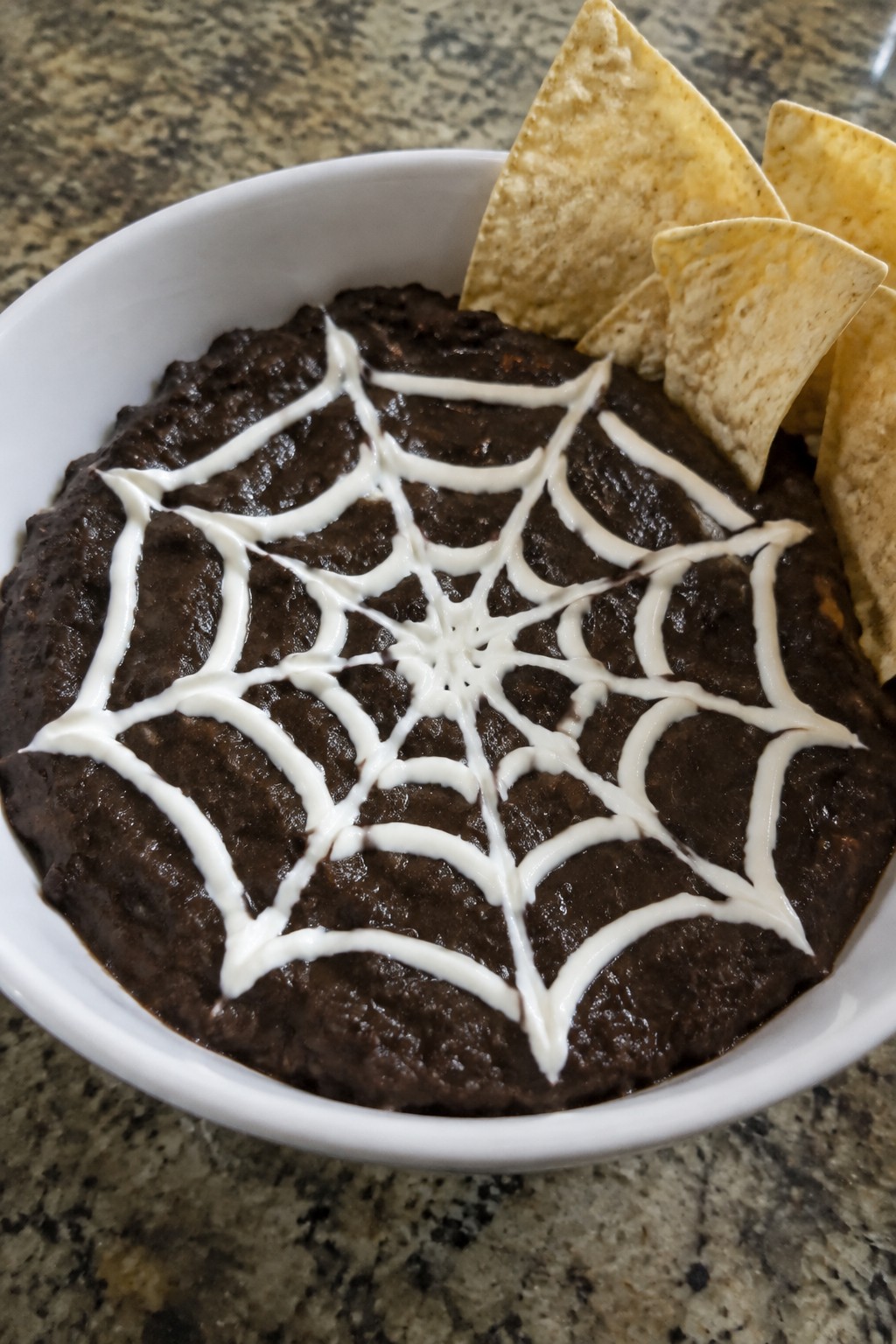 Spiderweb Black Bean Dip with Tortilla Chips