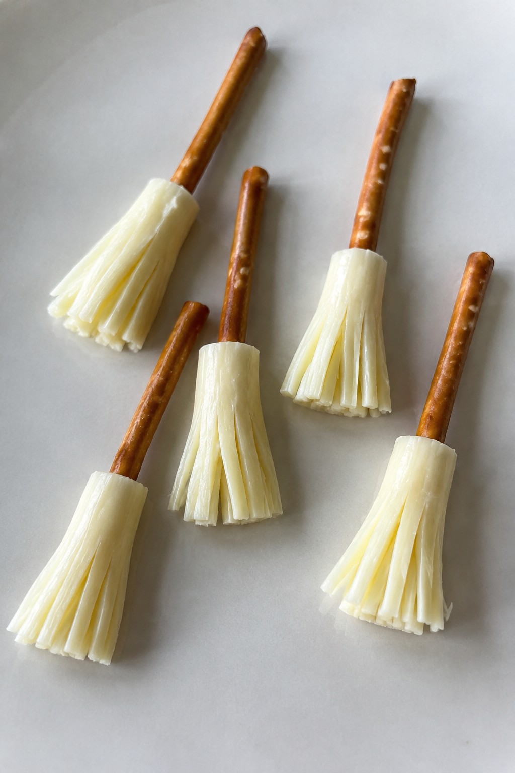 Witch's Broom Pretzel Sticks with String Cheese