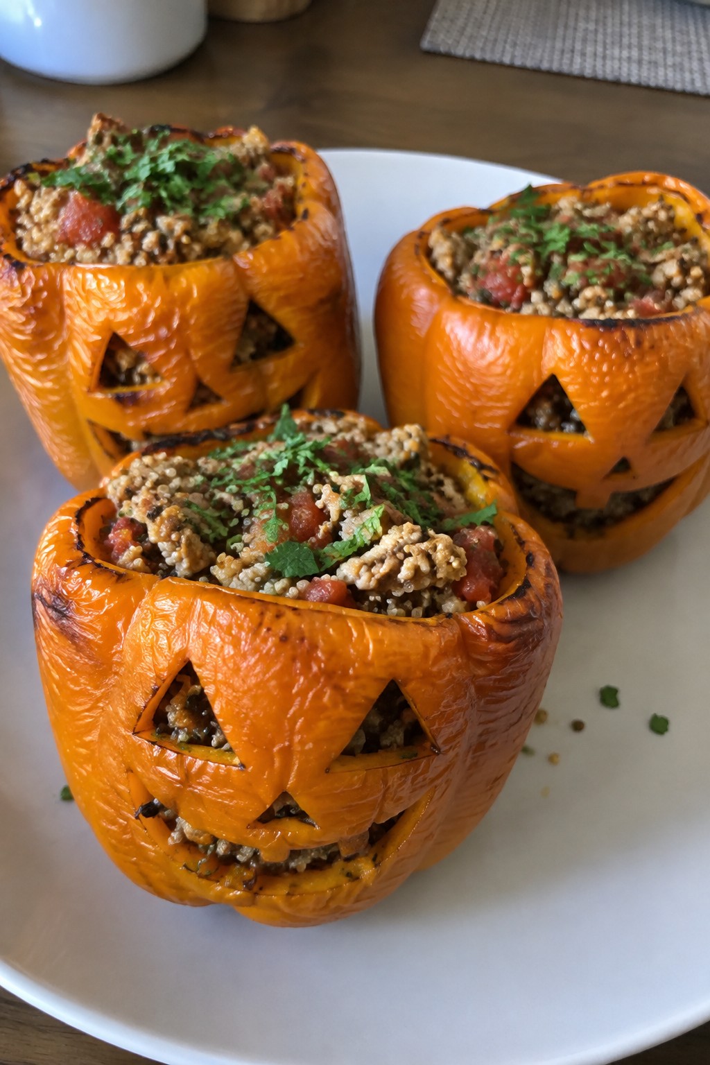 Jack-O'-Lantern Stuffed Bell Peppers with Turkey and Quinoa