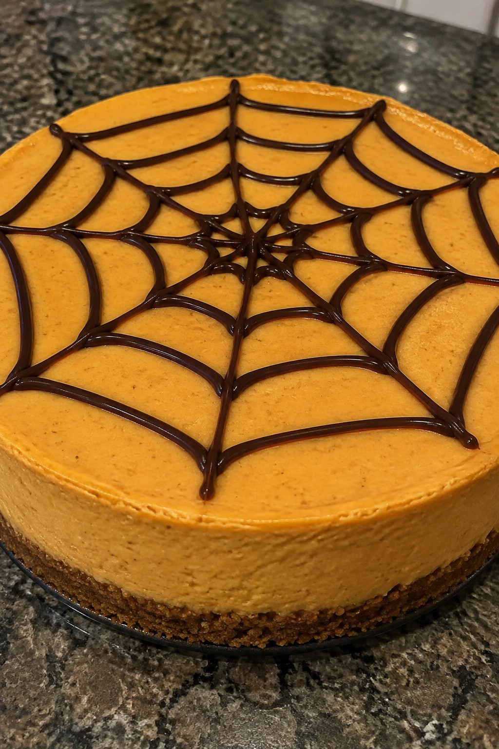 Spooky Spiderweb Pumpkin Cheesecake