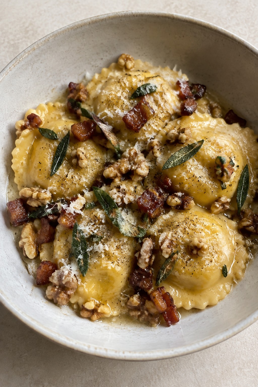 Pumpkin Sage Ravioli with Crispy Pancetta and Walnuts