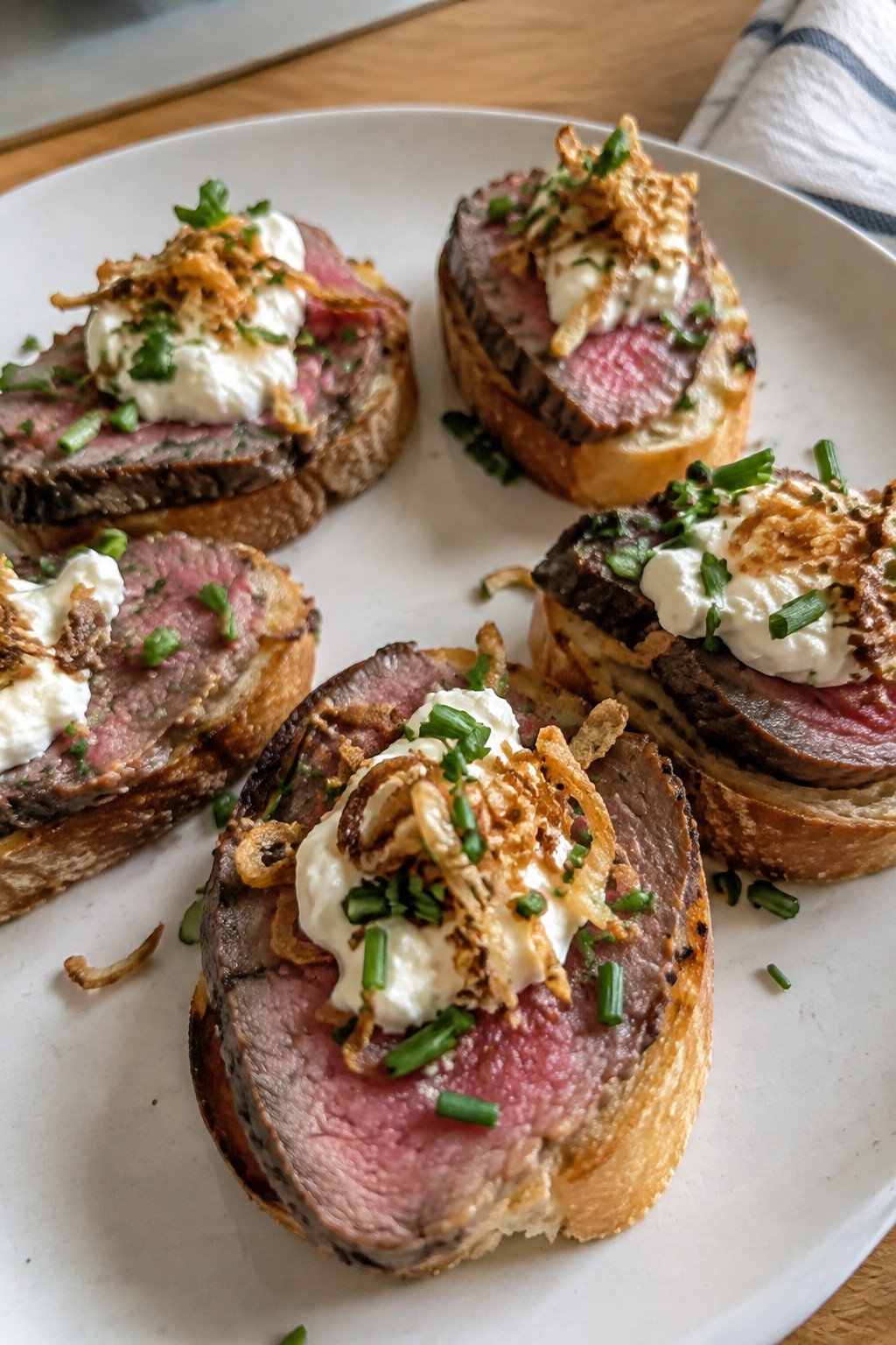 Beef Tenderloin Crostini with Horseradish Cream and Crispy Shallots