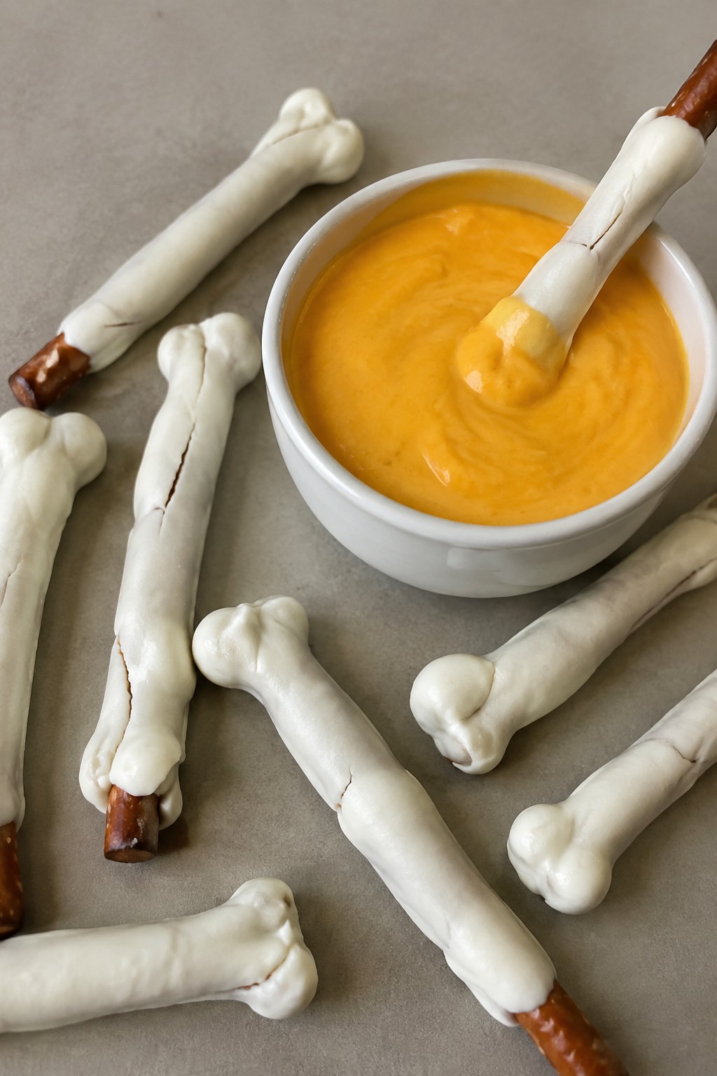 Skeleton Bone Pretzel Rods with Cheese Sauce