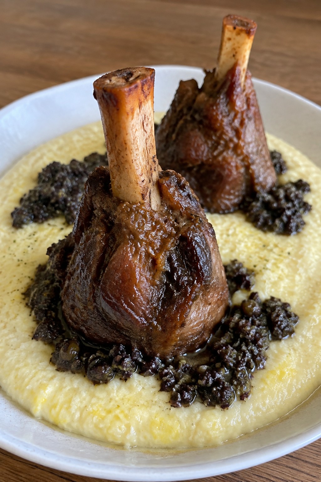Lamb Shank “Graveyard” with Olive Tapenade and Creamy Polenta