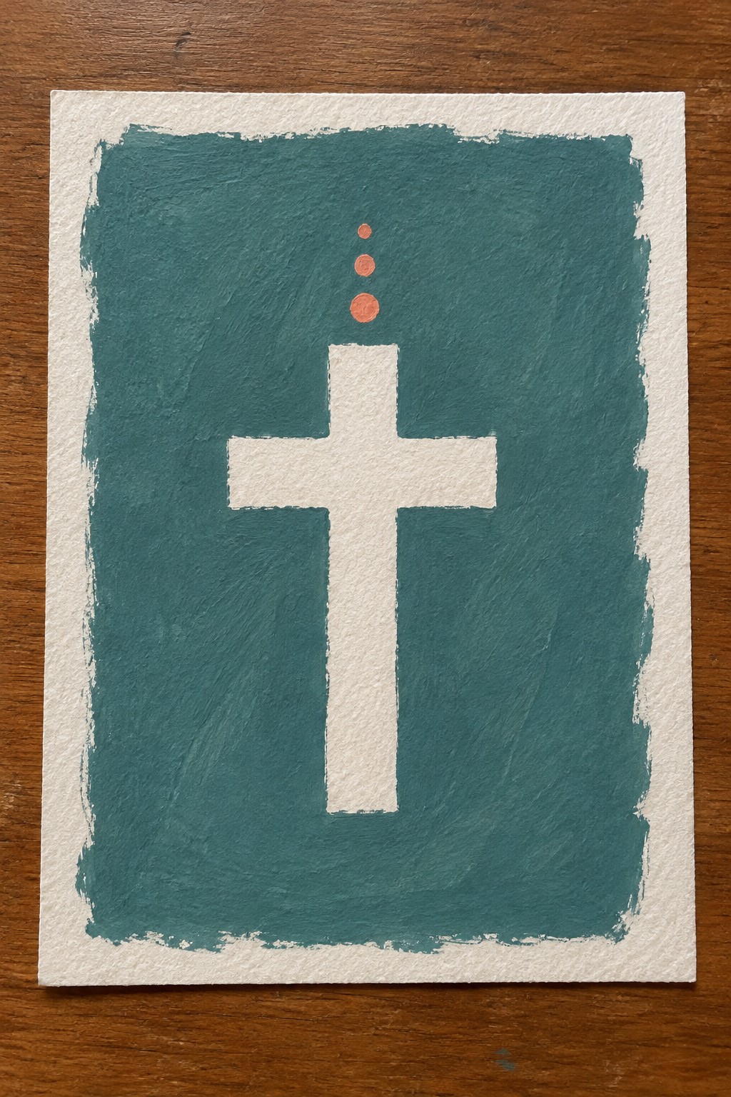 White cross centered on textured teal background with three orange dots above