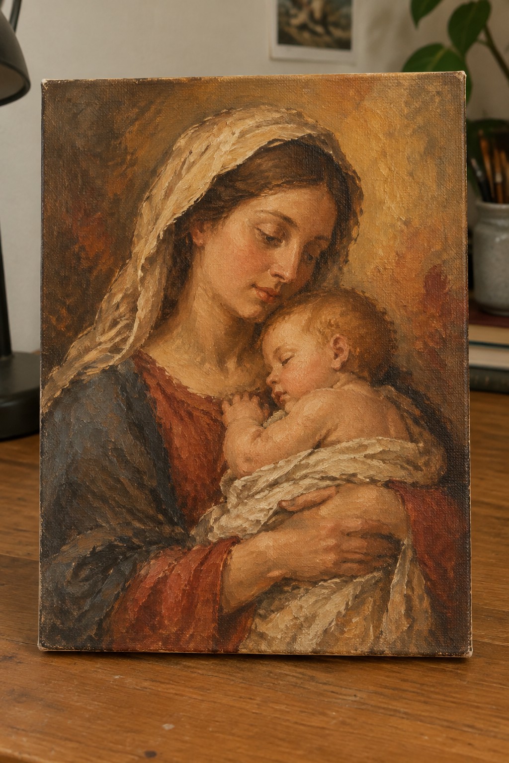 Classical oil painting of veiled woman in red cradling sleeping baby