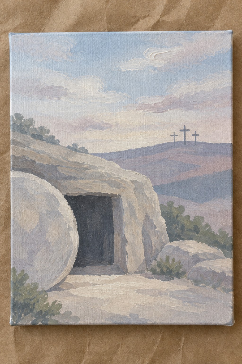 Painting of rocky tomb with large stone aside and three crosses on distant hill